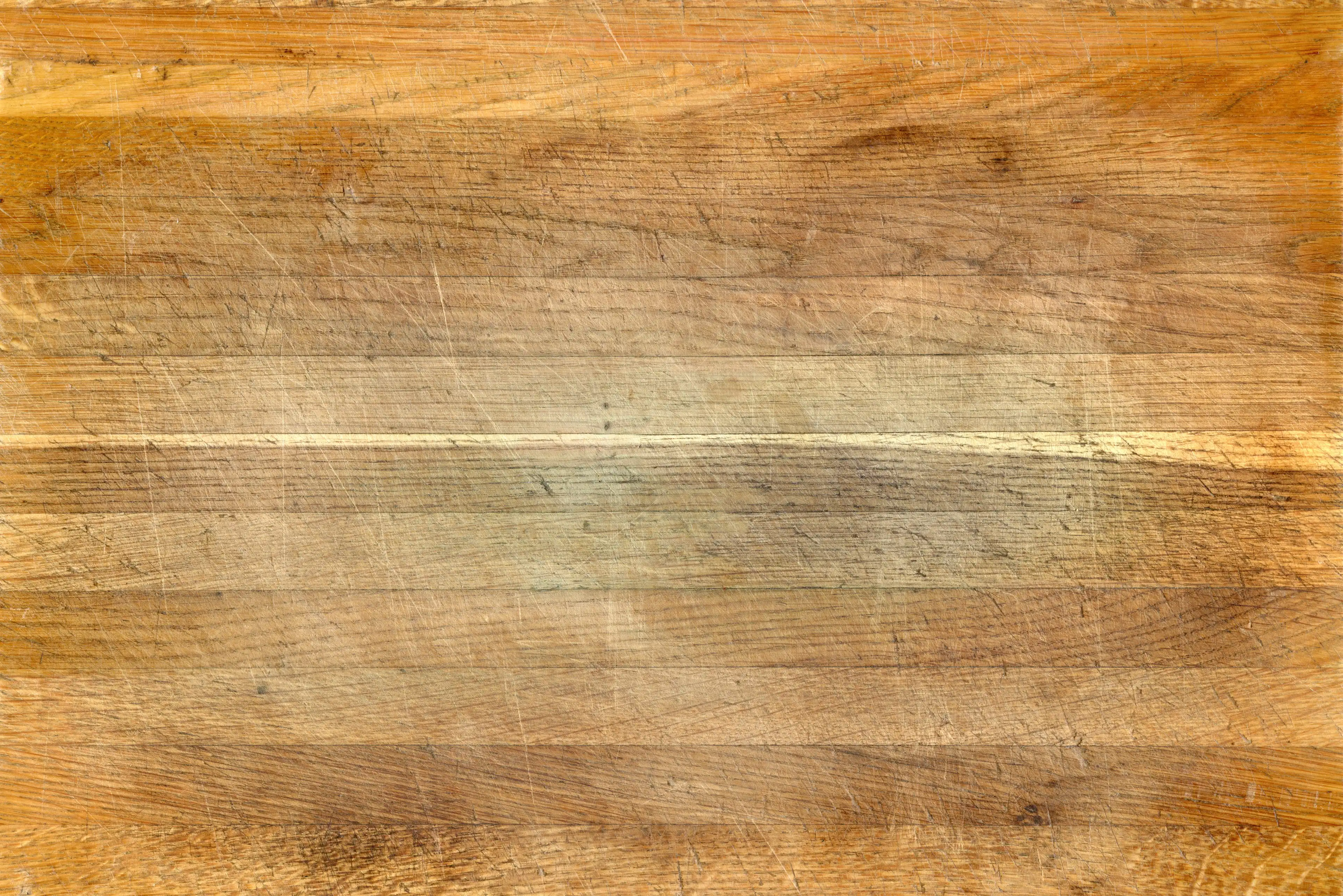A big rectangular vertically seamless texture of old used kitchen chopping board.